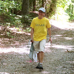 Jill sweeping and collecting trail signs